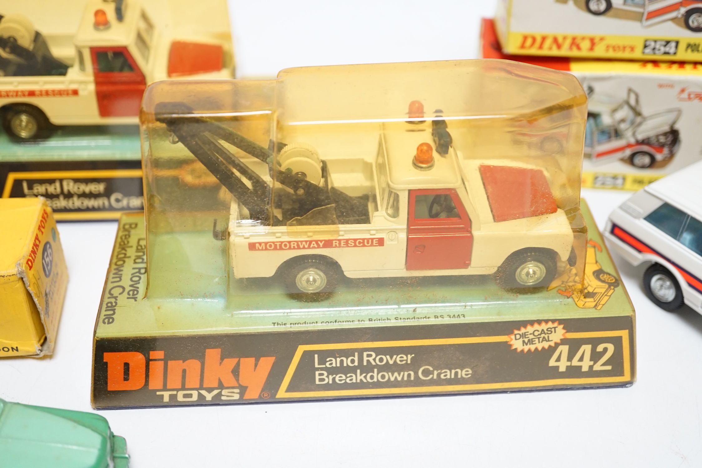 Five boxed Dinky Toys; Rover 75 Saloon (156) in correct two-tone green colour spot box, two Police Patrol Range Rover (254) and two Land Rover Breakdown Crane (442)